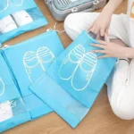 kf-Se1ae6dddfa904ae6a948551b05dced35a-Reusable-Non-woven-Shoes-Storage-Organizer-Bags-Travel-Portable-Closet-Bag-Waterproof-Pocket-Clothing-Tranparent-Hanging