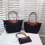 kf-Sc961f66b543c4cbdbcce70a6e3fdeec74-Classic-Foldable-Dumpling-Bun-Bag-Waterproof-Nylon-Embroidered-Dumpling-Bag-Fashion-Shoulder-Bag-Handbag-Mommy-Tote