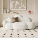 kf-Sfa88d742d0504973a8b69cae13a82f65K-Nordic-designer-cloud-sofa-lambskin-arc-hotel-beauty-salon-homestay-fabric-special-shaped-wabi-sabi-style