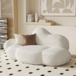 kf-Sfa88d742d0504973a8b69cae13a82f65K-Nordic-designer-cloud-sofa-lambskin-arc-hotel-beauty-salon-homestay-fabric-special-shaped-wabi-sabi-style