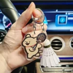kf-Sb7f83c52487a4a7ab046a1eb3b089fe4E-YONEX-Cartoon-Badminton-Bag-Keychain-Fashionable-Cute-Tennis-Racket-Backpack-Keychain-Acrylic-Pendant-Couple-s-Gift